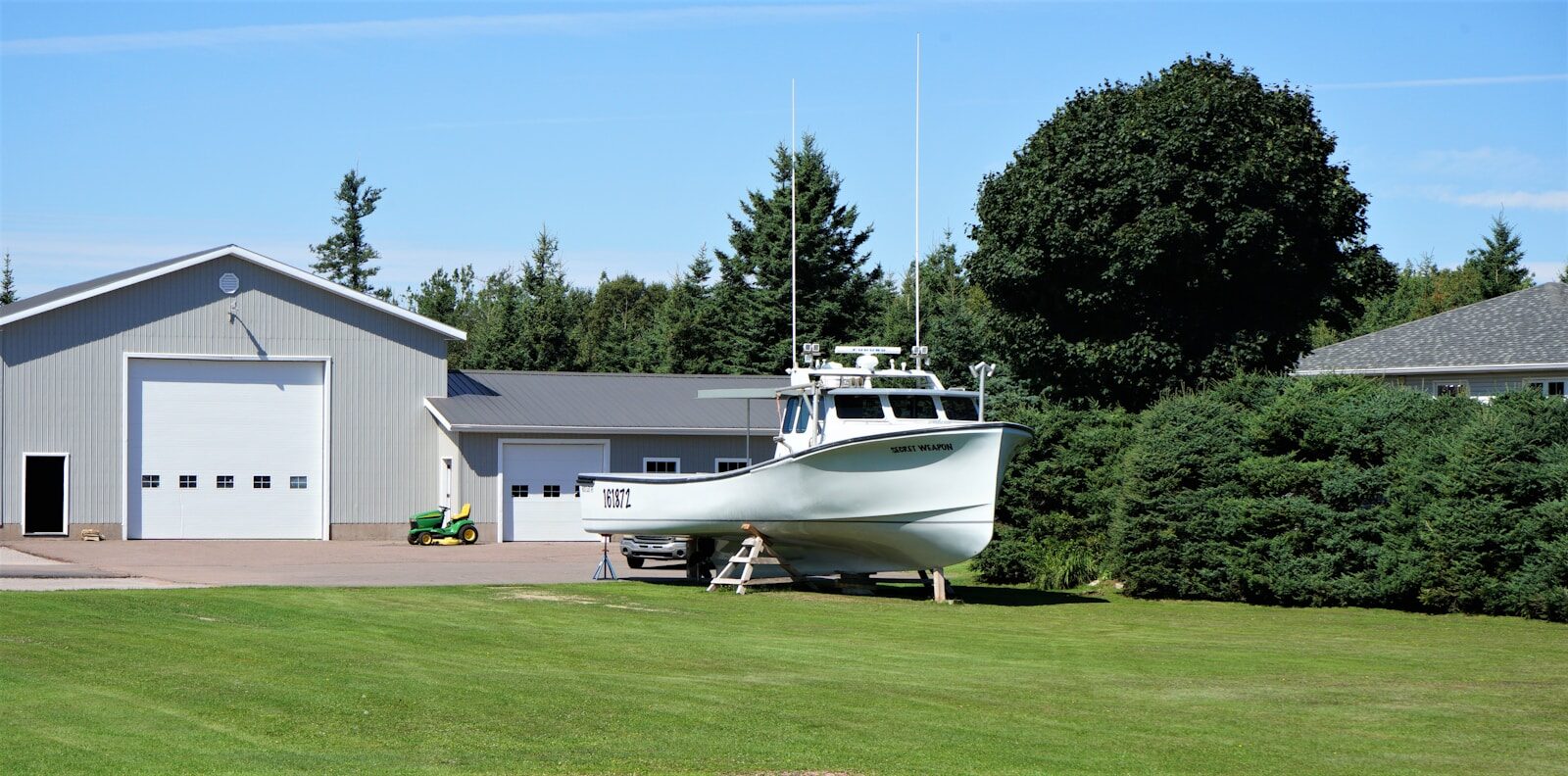 a boat parked in a yard